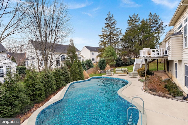 view of pool with a deck and a patio area