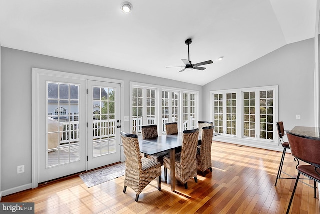 dining room featuring vaulted ceiling, ceiling fan, and light hardwood / wood-style flooring