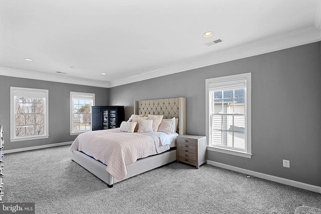 bedroom featuring crown molding and carpet