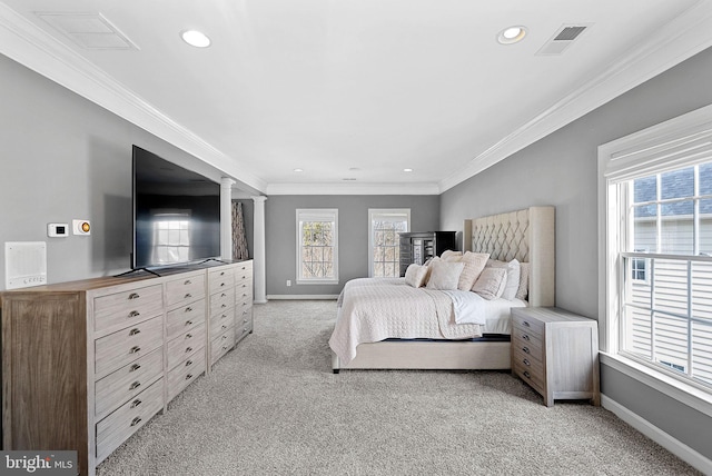 carpeted bedroom featuring crown molding