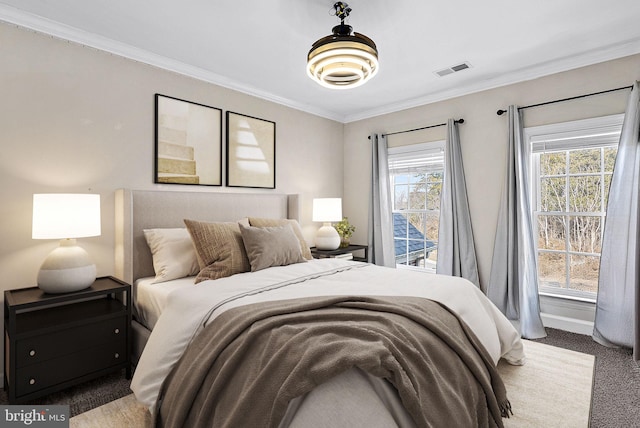 bedroom with carpet floors and ornamental molding