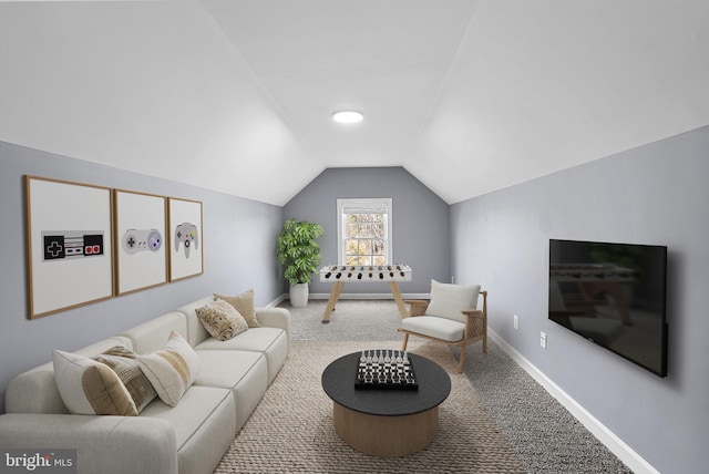 living room featuring lofted ceiling and carpet flooring