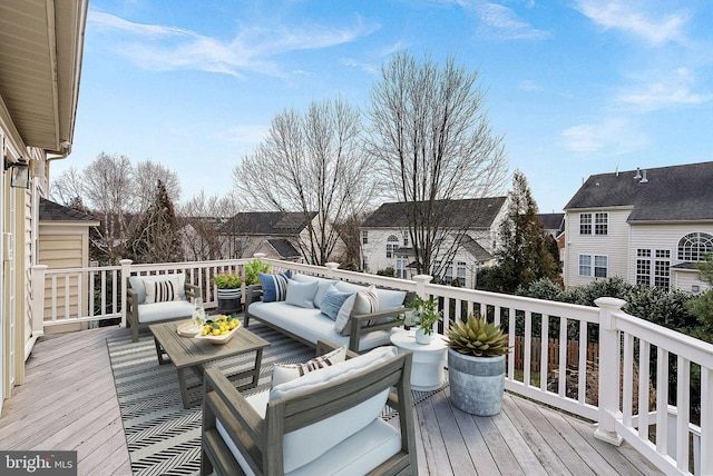 wooden deck featuring an outdoor hangout area