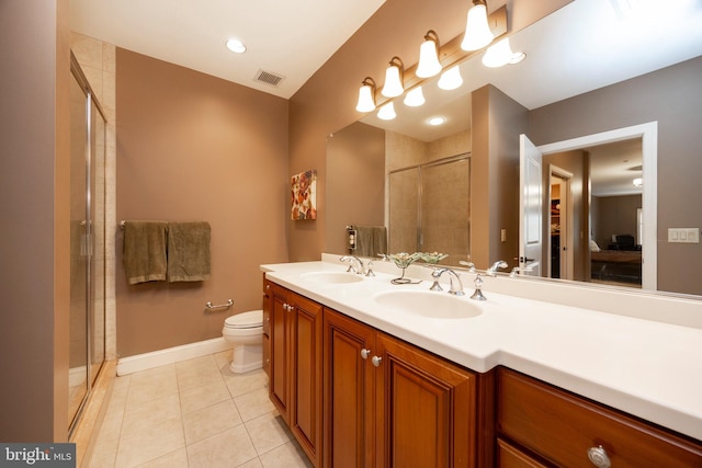 ensuite bathroom with a sink, a stall shower, connected bathroom, and visible vents