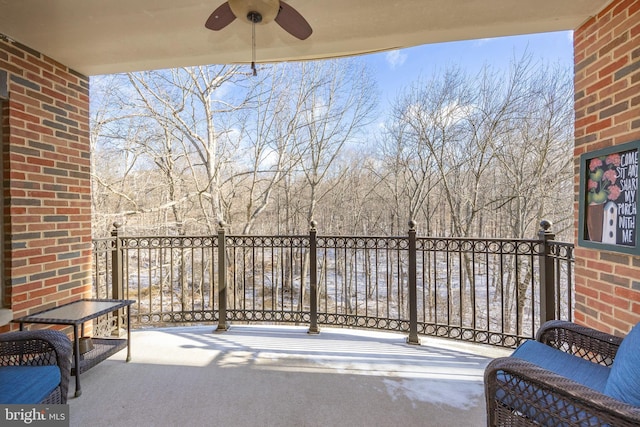 balcony featuring a ceiling fan