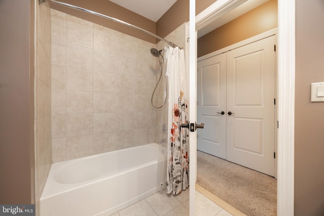 bathroom featuring shower / bathtub combination with curtain and tile patterned floors