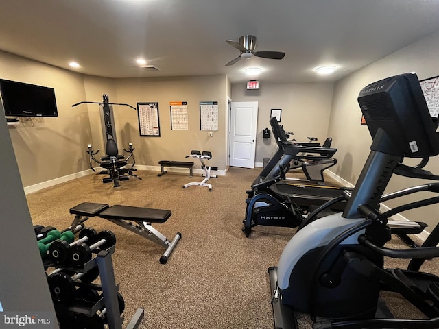 gym featuring ceiling fan and baseboards