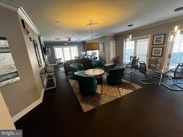 dining area featuring baseboards, visible vents, ornamental molding, and ceiling fan