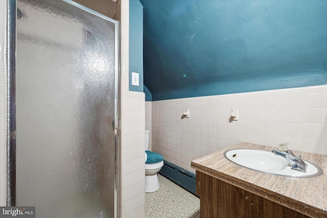 bathroom featuring a shower with shower door, a baseboard radiator, tile patterned flooring, vanity, and toilet