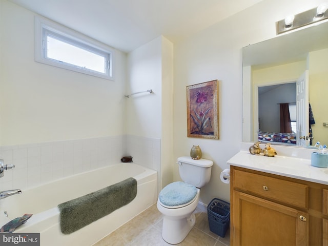 ensuite bathroom featuring a garden tub, toilet, ensuite bathroom, vanity, and tile patterned floors