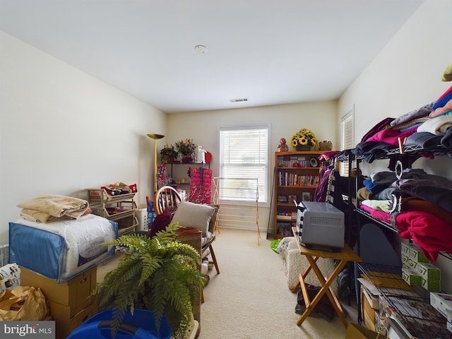 bedroom featuring carpet floors and visible vents