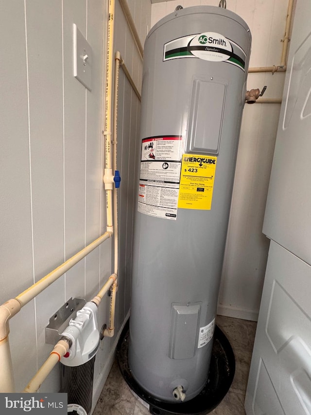 utility room featuring electric water heater