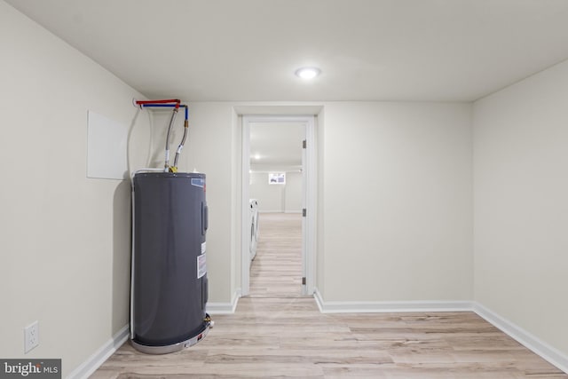 utility room with electric water heater