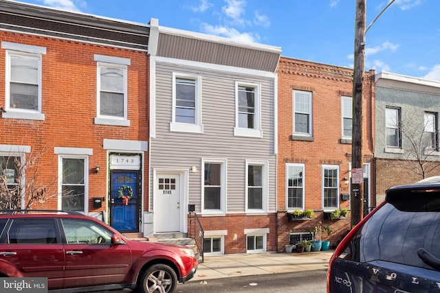 view of property with brick siding