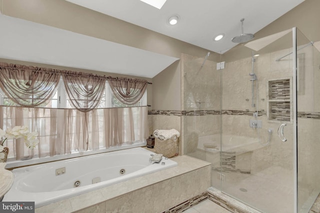 bathroom with shower with separate bathtub