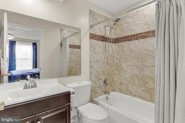 full bathroom featuring vanity, shower / bath combo, and toilet