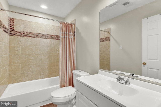 full bathroom featuring vanity, toilet, and shower / tub combo