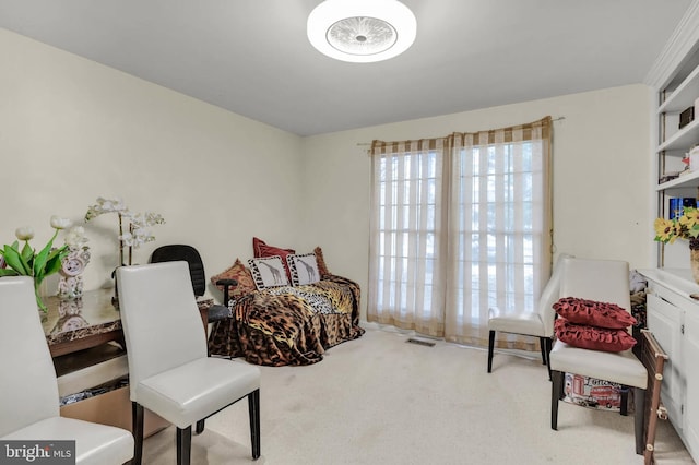 living area with light carpet