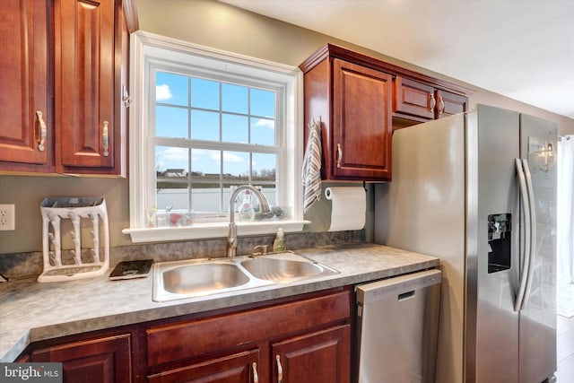 kitchen featuring appliances with stainless steel finishes and sink