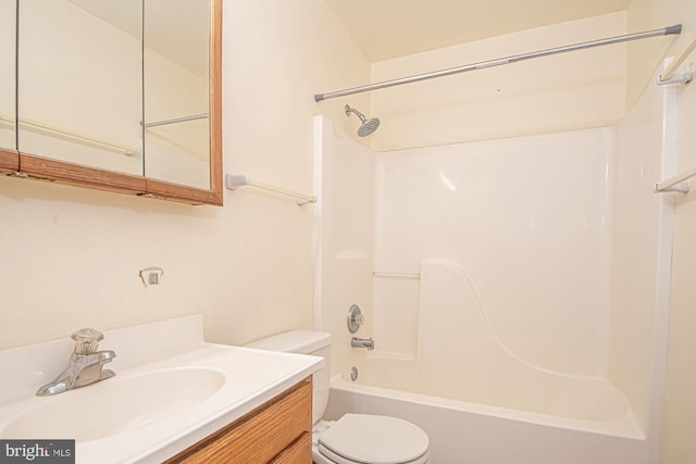 full bath with tub / shower combination, vanity, and toilet