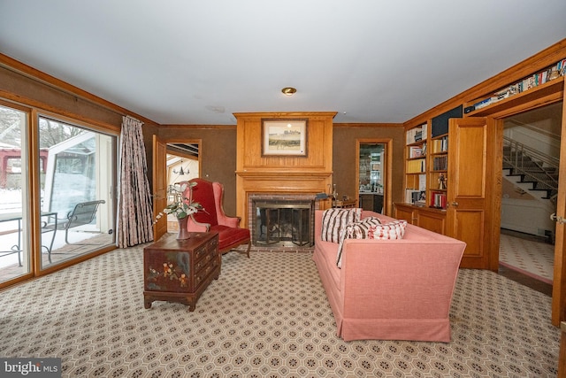 carpeted living room with ornamental molding and a brick fireplace