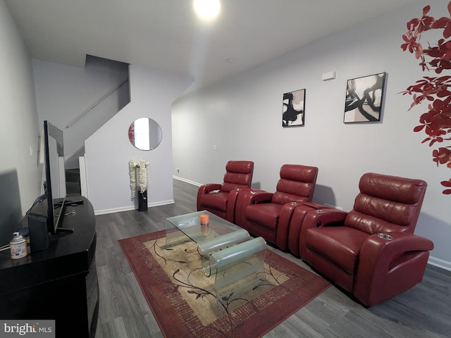 cinema room with dark hardwood / wood-style floors