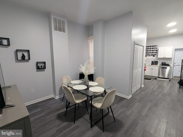 dining space with dark wood-type flooring