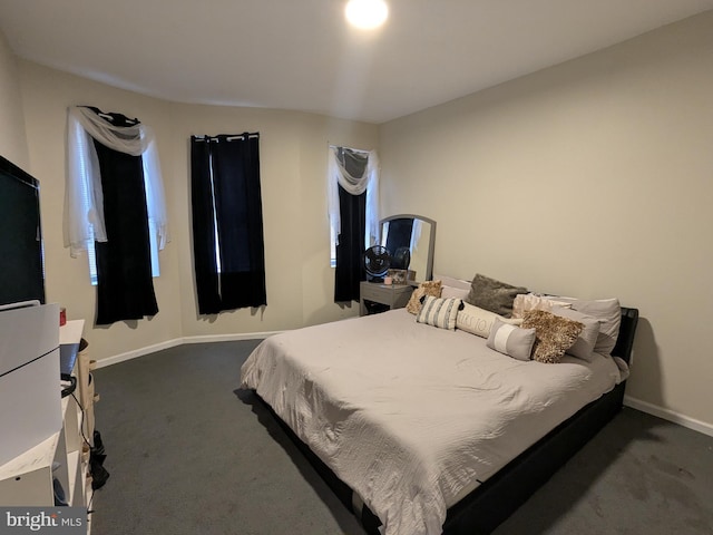 bedroom with dark carpet