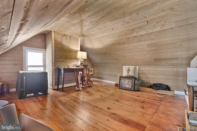 bonus room with lofted ceiling, wood ceiling, wooden walls, and wood finished floors