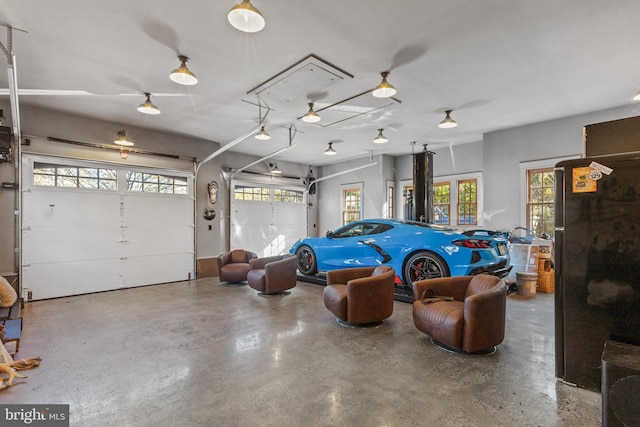 garage with freestanding refrigerator