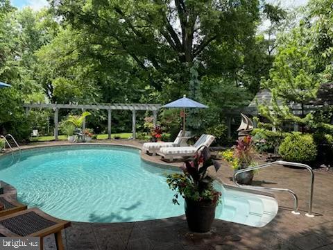 outdoor pool with a pergola