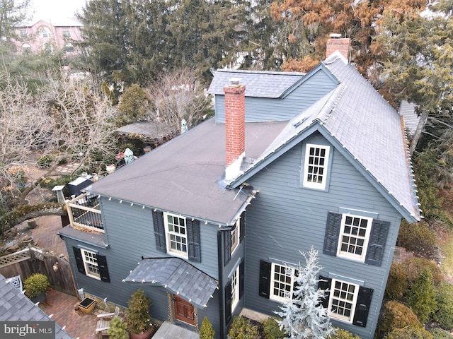 view of front facade with a chimney