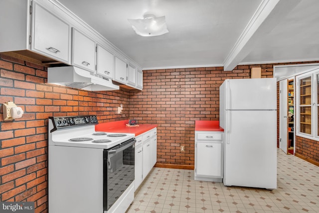 kitchen featuring crown molding, white appliances, white cabinets, and brick wall