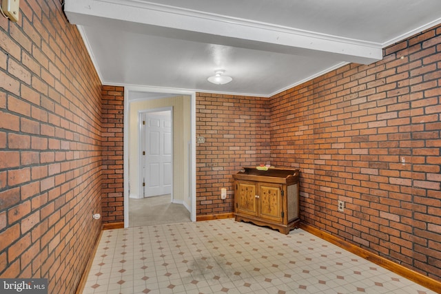 hall with crown molding, brick wall, and beam ceiling