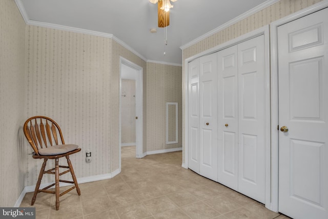 living area featuring crown molding