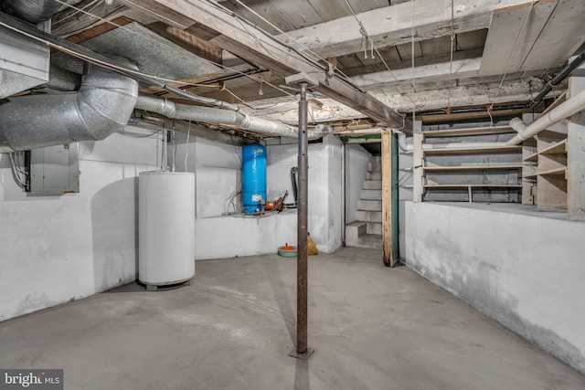 basement featuring water heater and electric panel