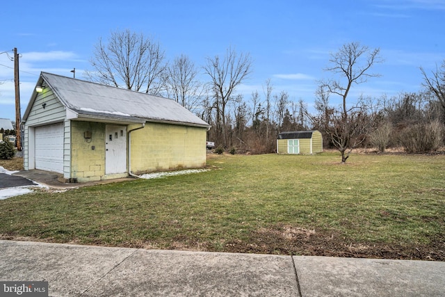 exterior space featuring a yard and a garage