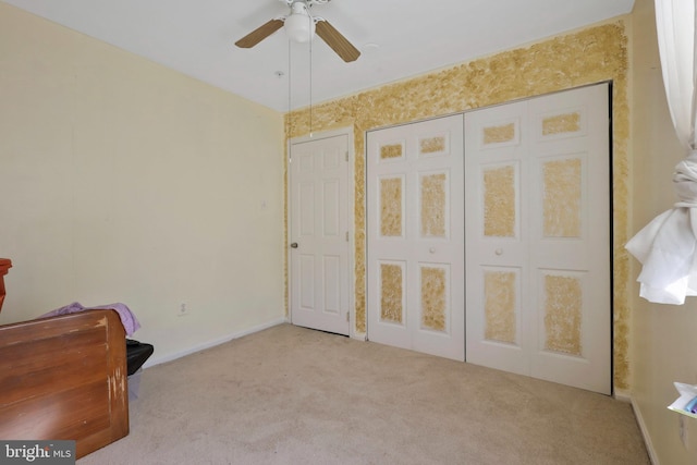 bedroom featuring ceiling fan and light carpet