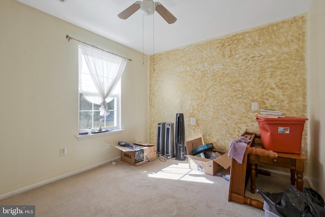 carpeted spare room with a wealth of natural light and ceiling fan