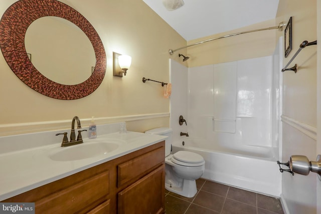 full bathroom with shower / bathing tub combination, vanity, tile patterned floors, and toilet