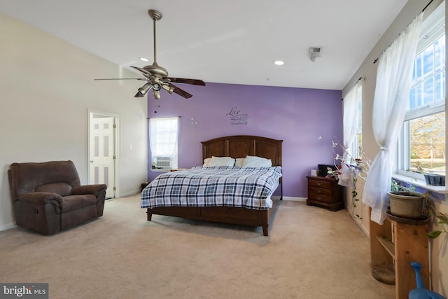 bedroom featuring light carpet and ceiling fan