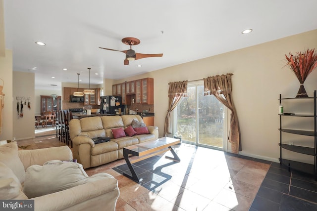 tiled living room featuring ceiling fan