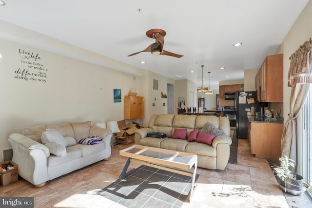 living room featuring ceiling fan