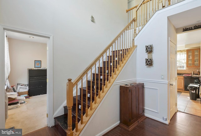 staircase with wood-type flooring