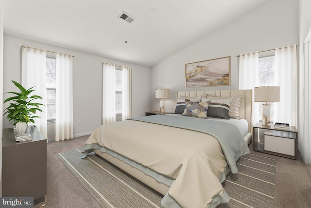 carpeted bedroom with vaulted ceiling