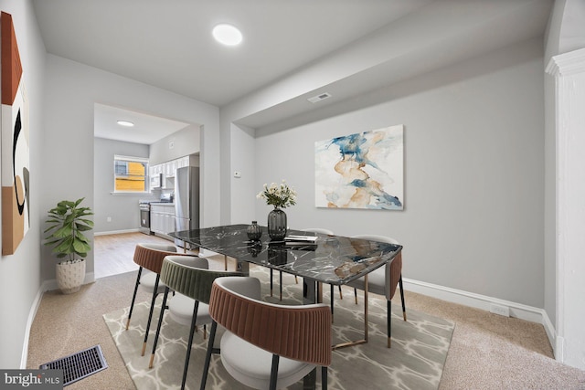 dining area featuring carpet floors