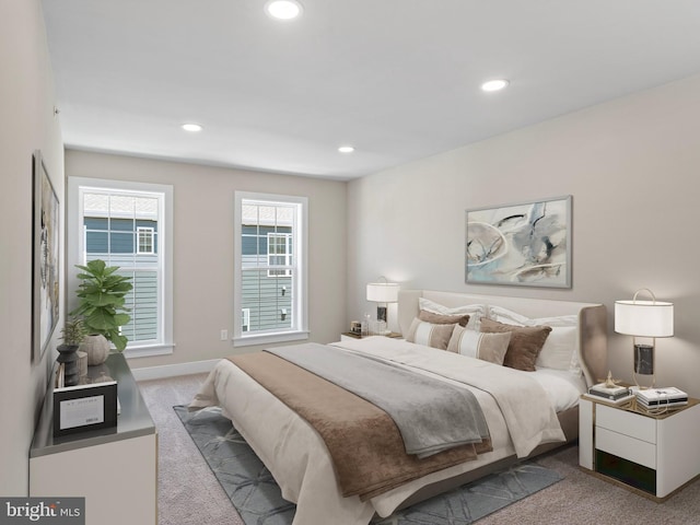 bedroom with light colored carpet