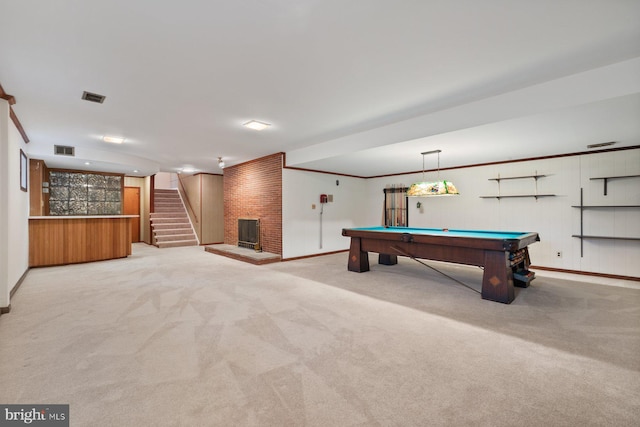 rec room featuring ornamental molding, light colored carpet, a fireplace, and billiards