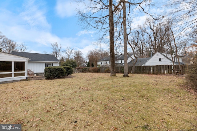 view of yard with a sunroom