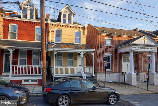 view of property featuring a porch